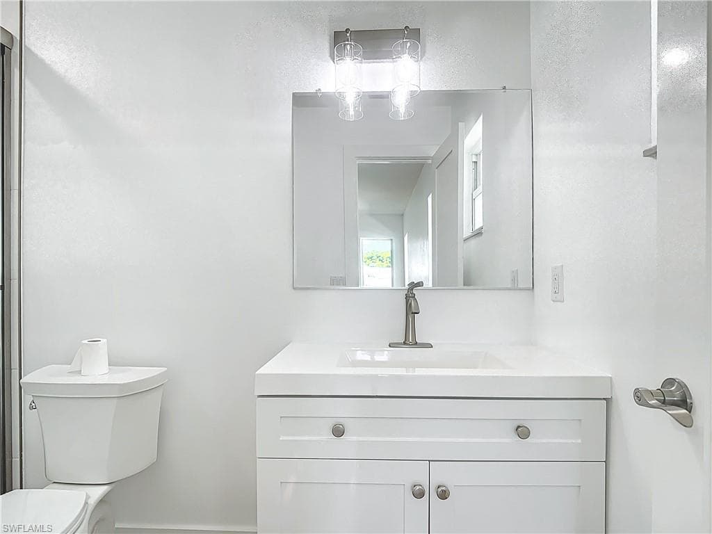 Bathroom with vanity and toilet