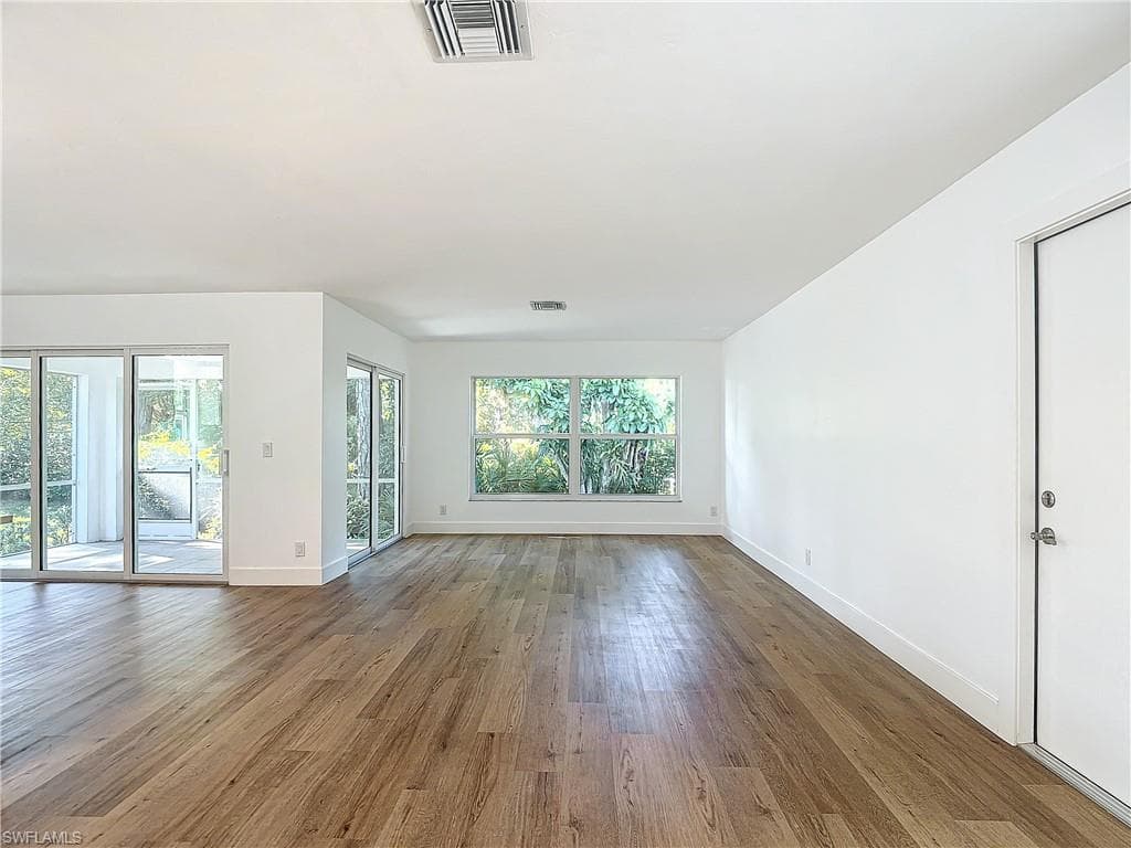 Empty room featuring hardwood / wood-style flooring