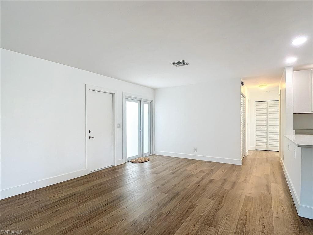 Spare room featuring light wood-type flooring