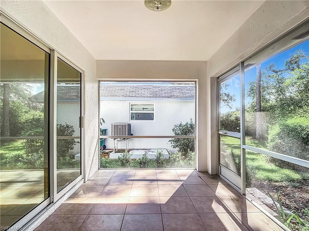 Unfurnished sunroom with a healthy amount of sunlight