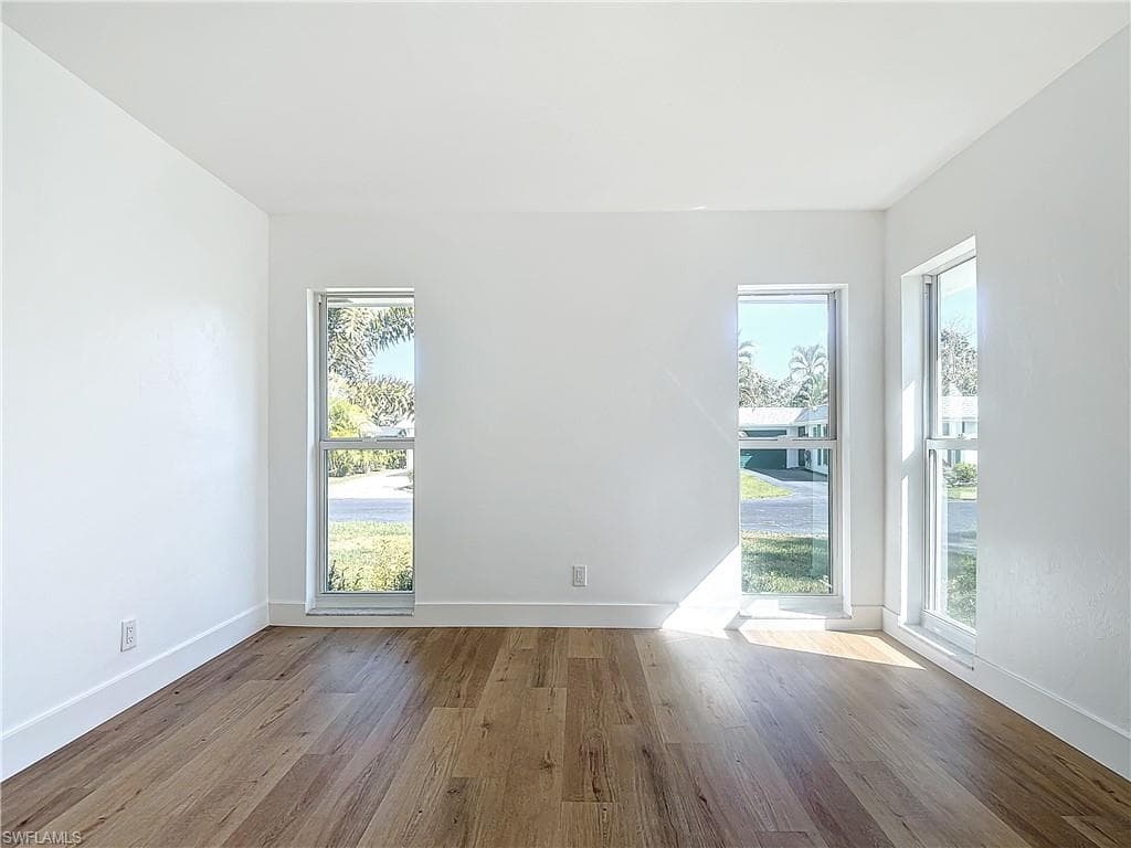Spare room featuring light wood-type flooring