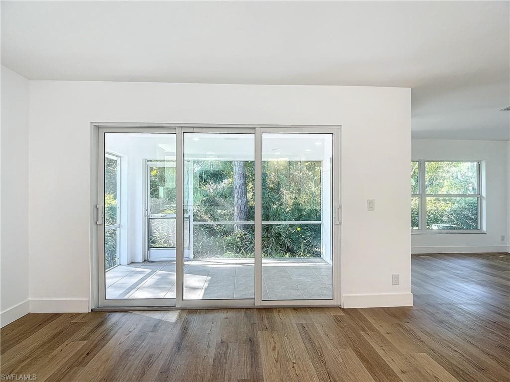 Doorway to outside featuring hardwood / wood-style floors