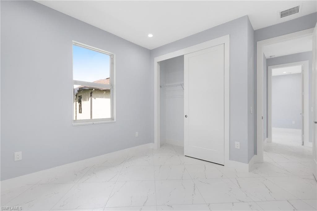 Unfurnished bedroom with a closet