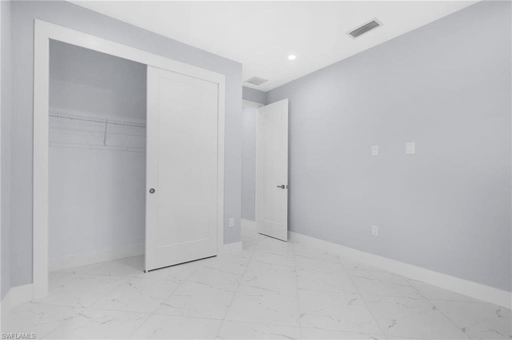 Unfurnished bedroom featuring a closet