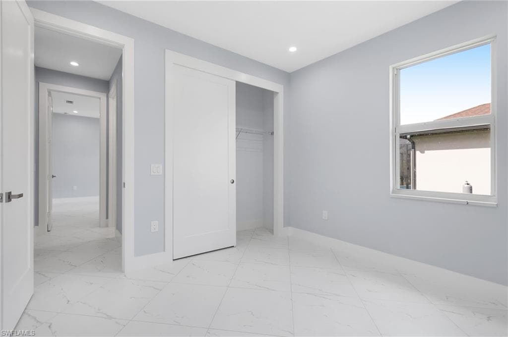 Unfurnished bedroom with a closet