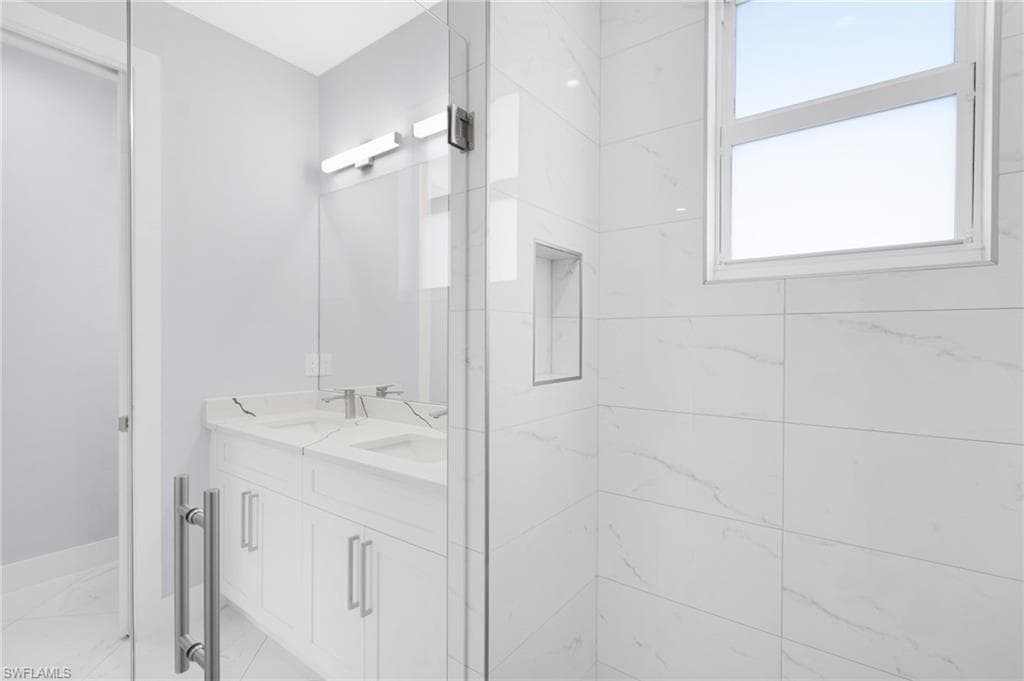 Bathroom with vanity and an enclosed shower