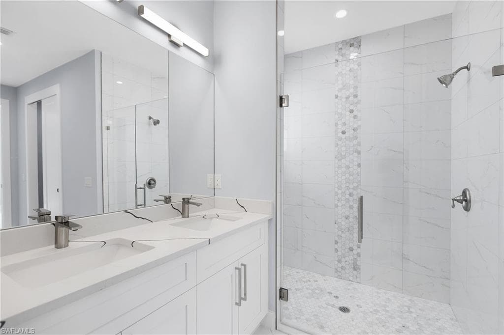 Bathroom with walk in shower and vanity