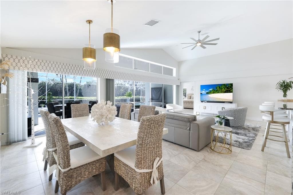 Dining space featuring vaulted ceiling and ceiling fan