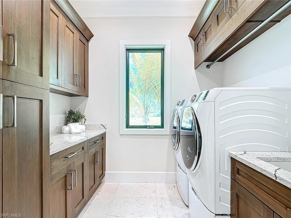 Large laundry room with tub in main house.