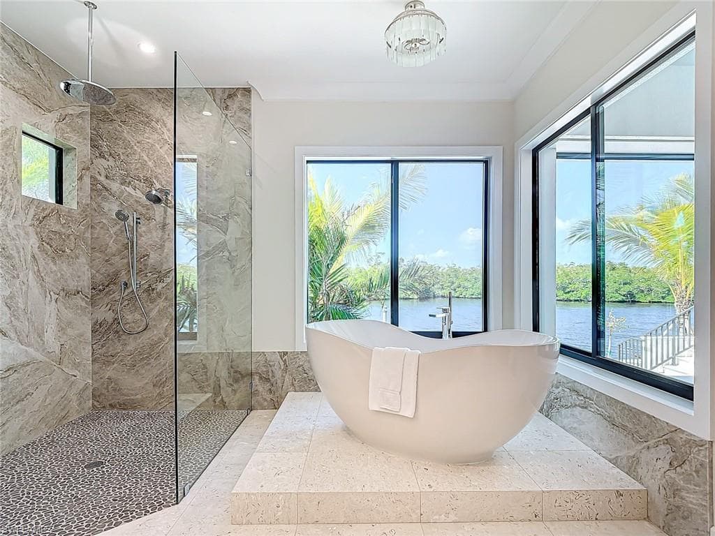 Soak after a long day with beautiful views.