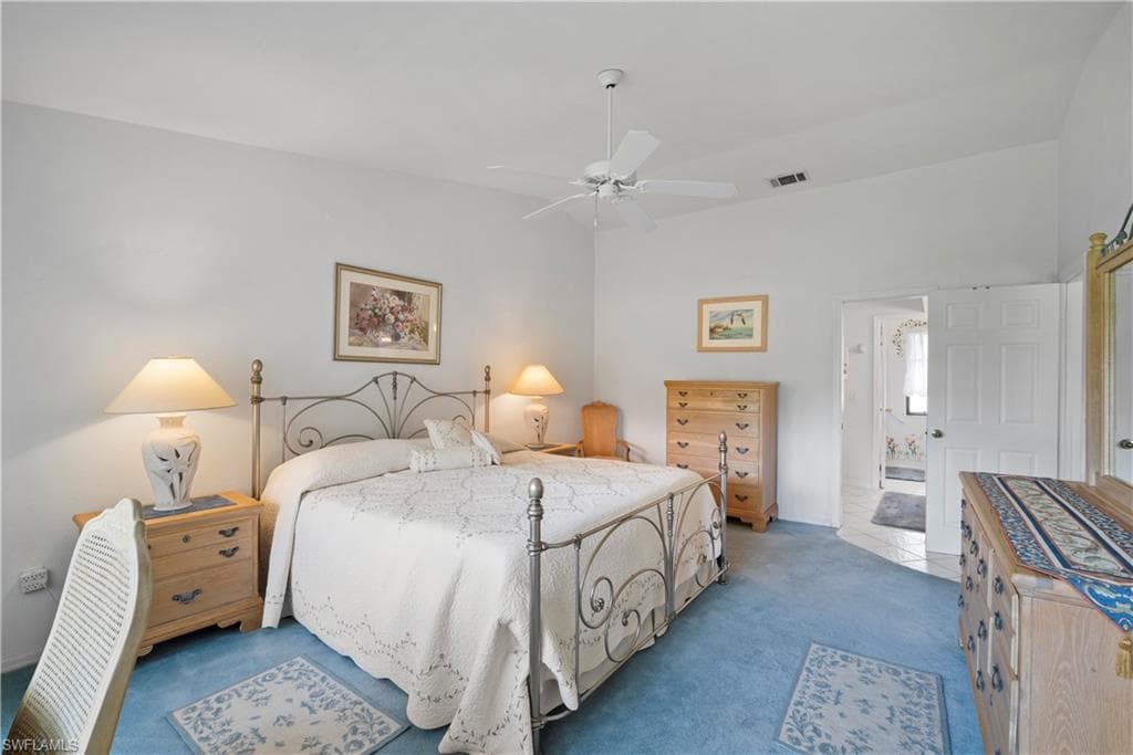 Bedroom with carpet flooring and ceiling fan