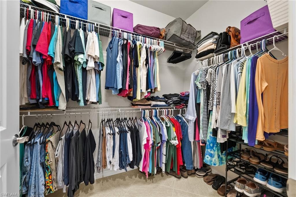 Spacious closet with tile patterned floors