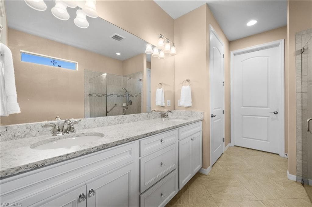 Bathroom with vanity and walk in shower