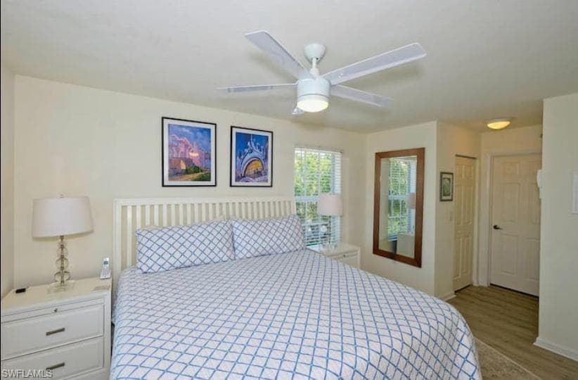 Bedroom featuring light hardwood / wood-style flooring, a closet, and ceiling fan