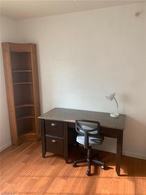 Office space featuring light hardwood / wood-style floors