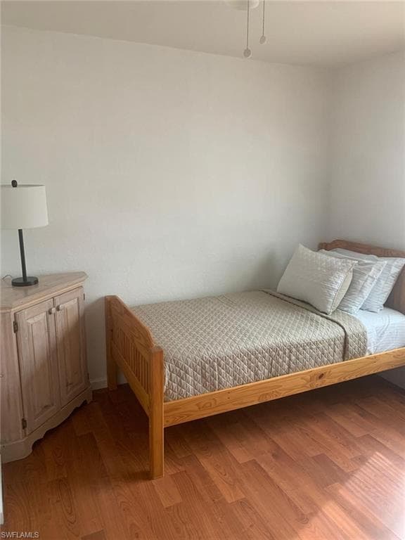 Bedroom with light hardwood / wood-style floors