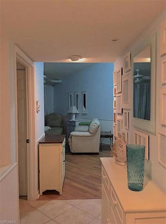 Hall with light hardwood / wood-style floors