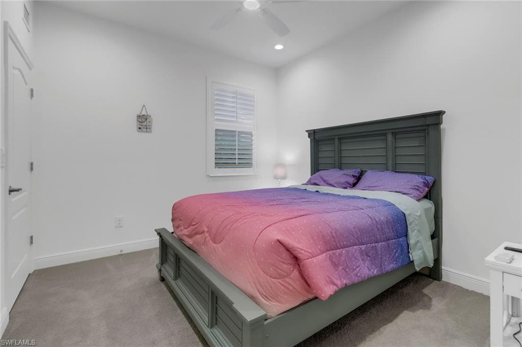 Guest Bedroom, walk in closet, plantation shutters and ceiling fan