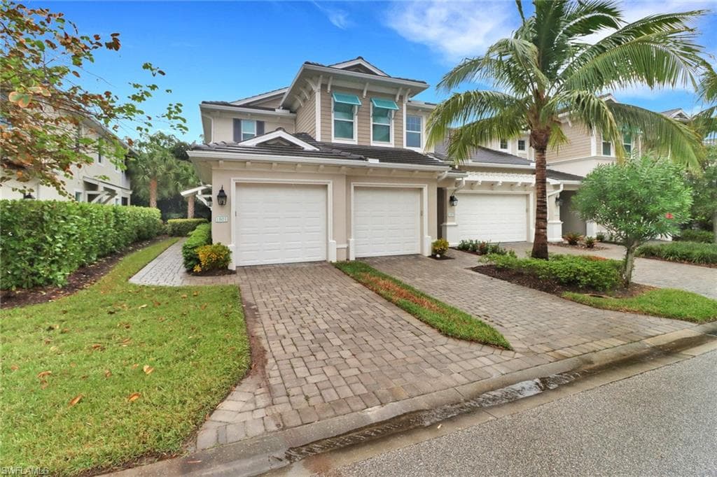 View of front of home with a garage, (door furthest to left)