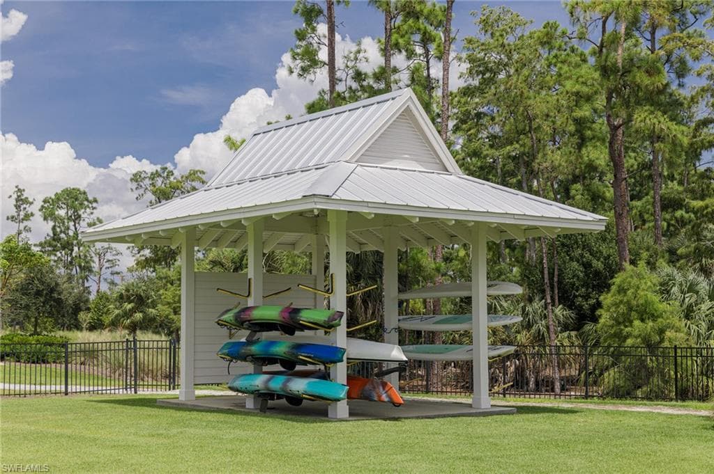 View of property's community with a gazebo and a yard
