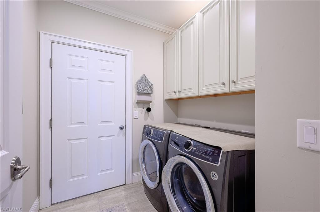 FUNCTIONAL IN RESIDENCE LAUNDRY LEADING TO GARAGE