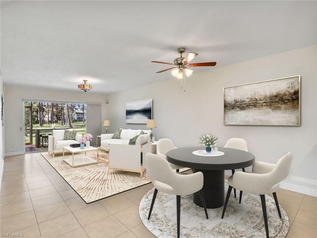 Dining room featuring ceiling fan and light tile patterned flooring