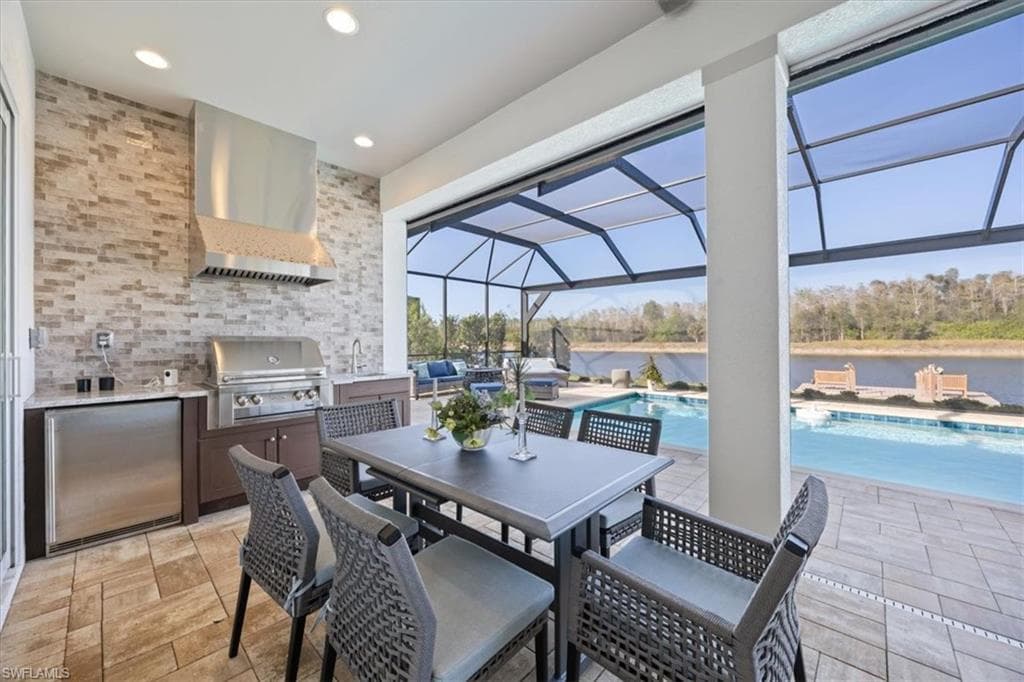 The outdoor kitchen and grill make dining al fresco so simple