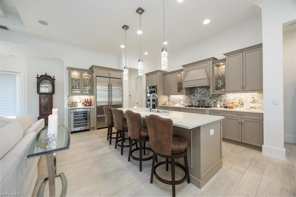 The quartz countertops and brilliant light fixtures and backsplash are just some of the many features that have been upgraded