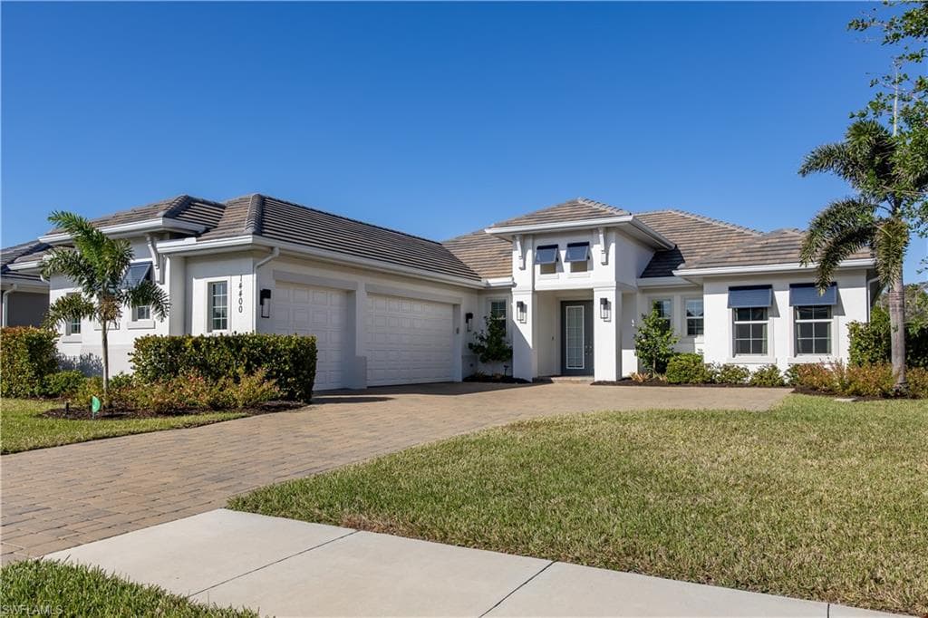 This stunning 4 bedroom home in Naples Reserve has been upgraded to the max - it even comes with a private dock