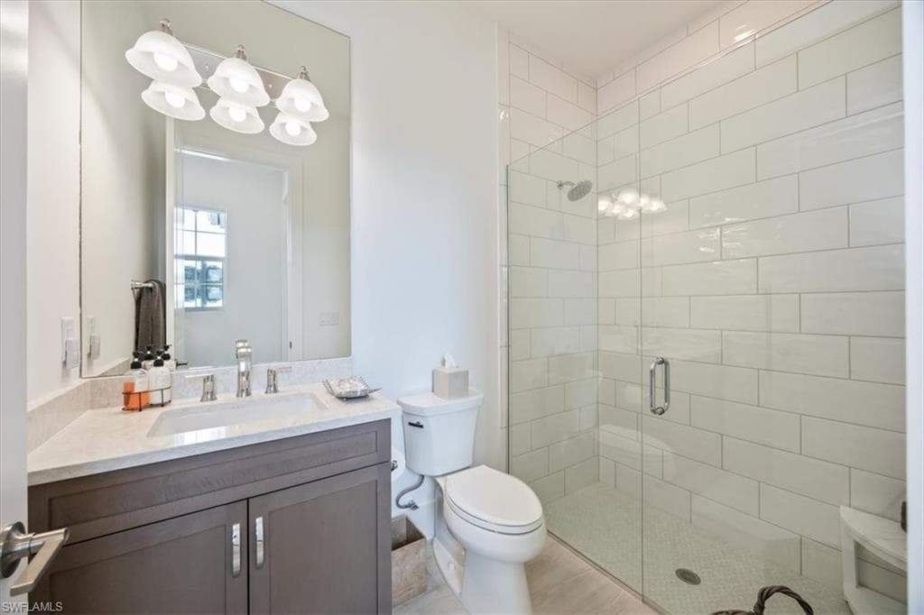 Third full bathroom located next to the front bedroom