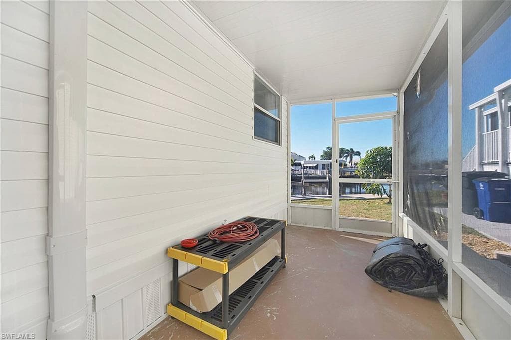 Screened in lanai with a water view