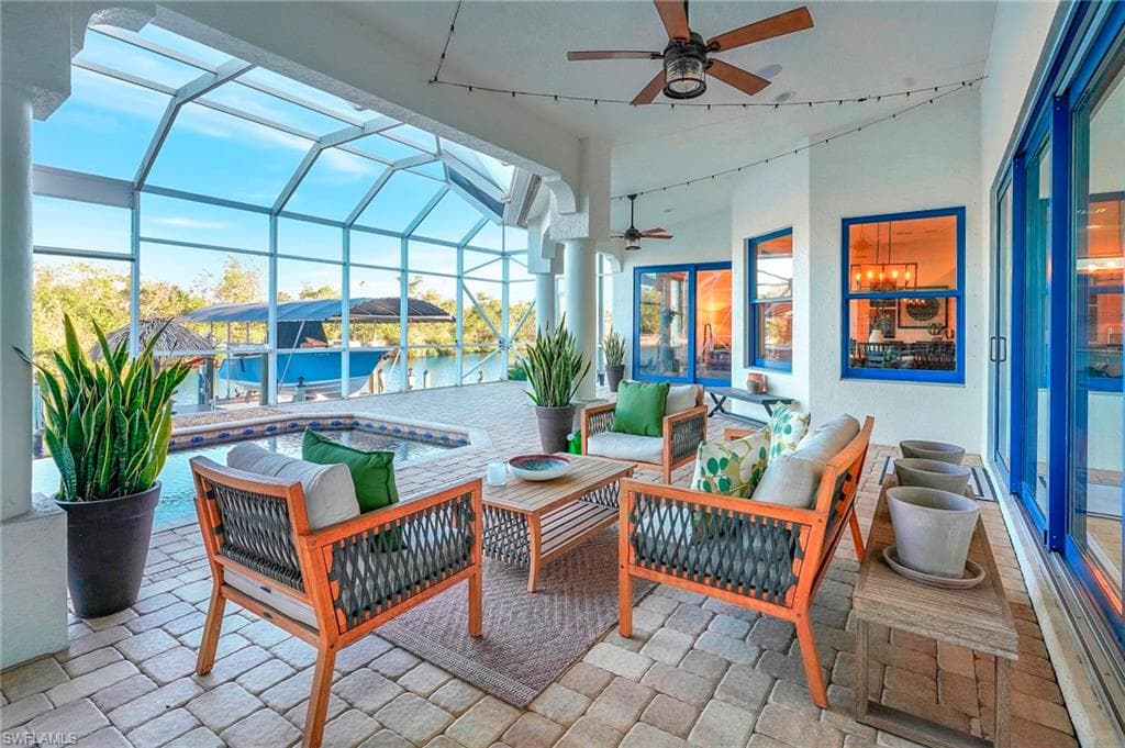 Lanai seating area featuring pool and canal view.