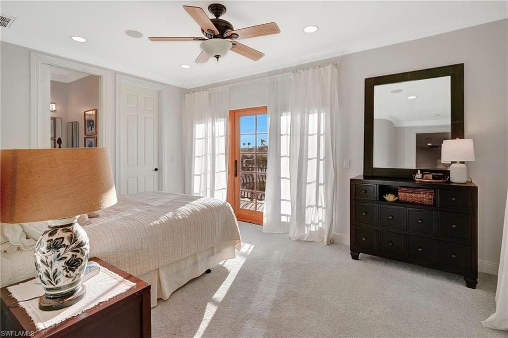 Carpeted bedroom with crown molding, access to outside, and ceiling fan