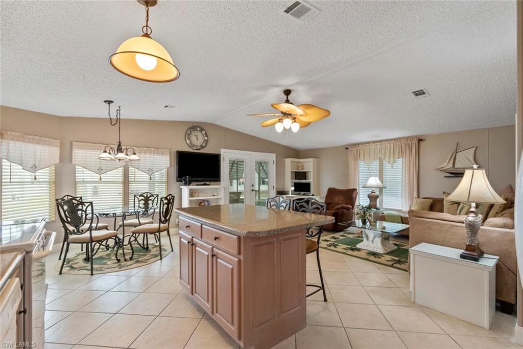 Kitchen with a kitchen bar, a kitchen island