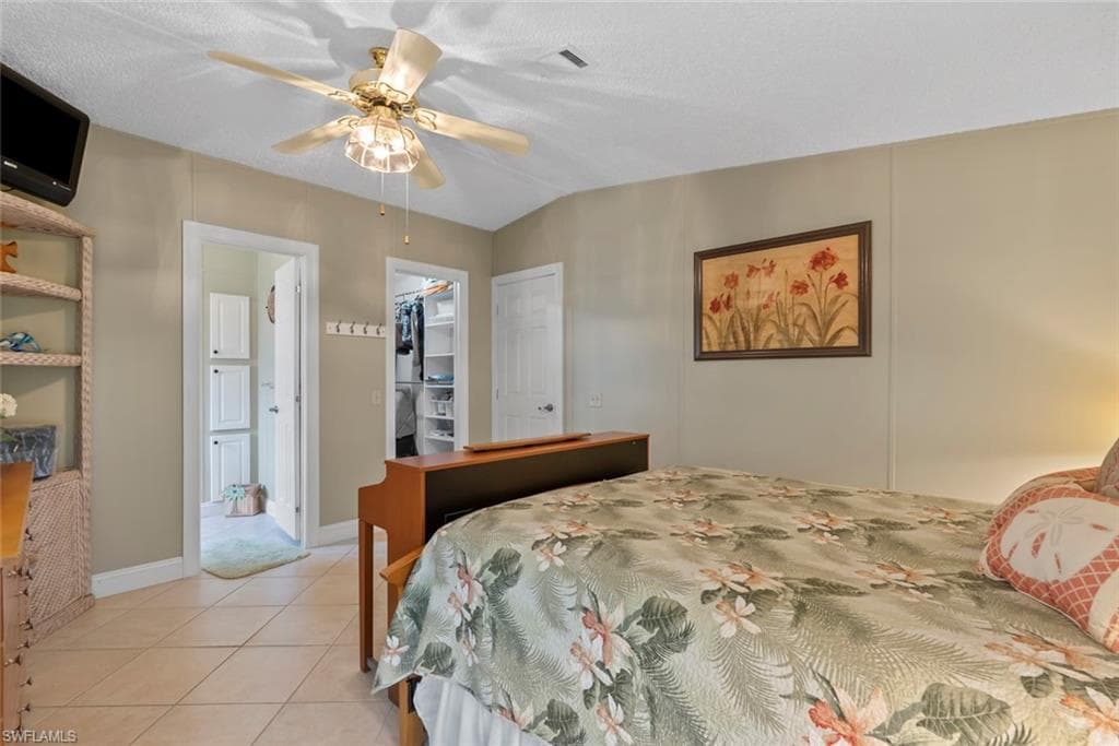 Tiled bedroom and a spacious closet
