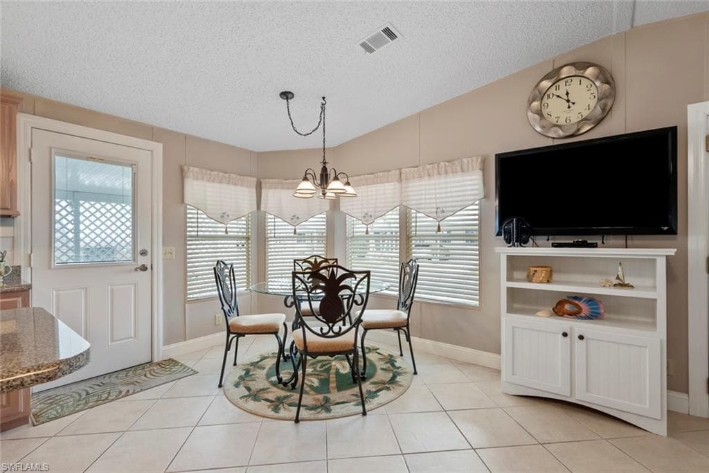 Dining area with lofted ceiling