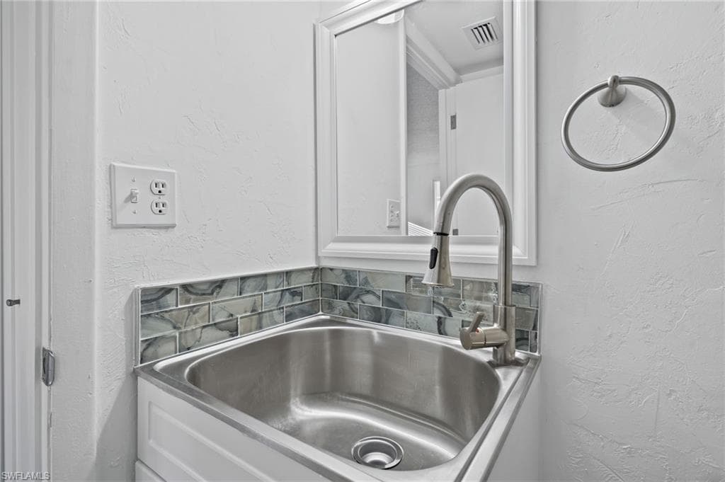 Room details featuring sink. First Floor Bathroom