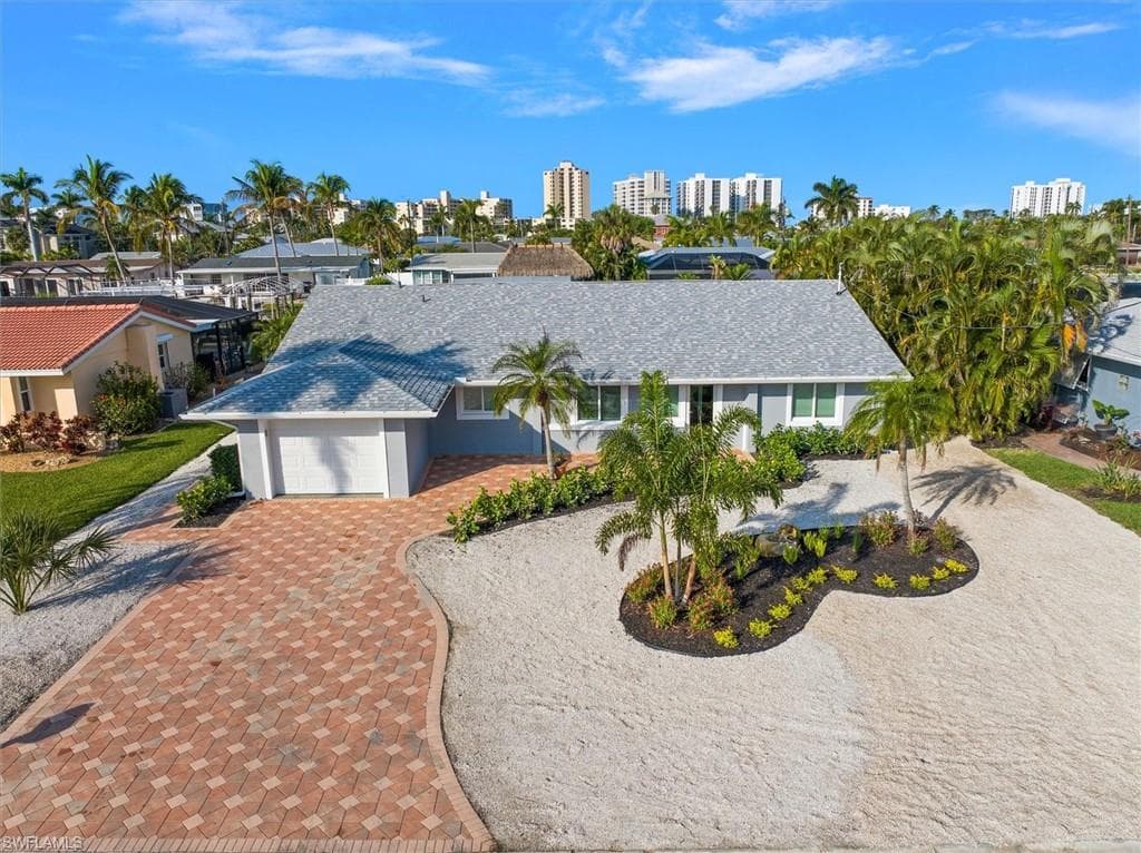 View of front of property featuring a garage
