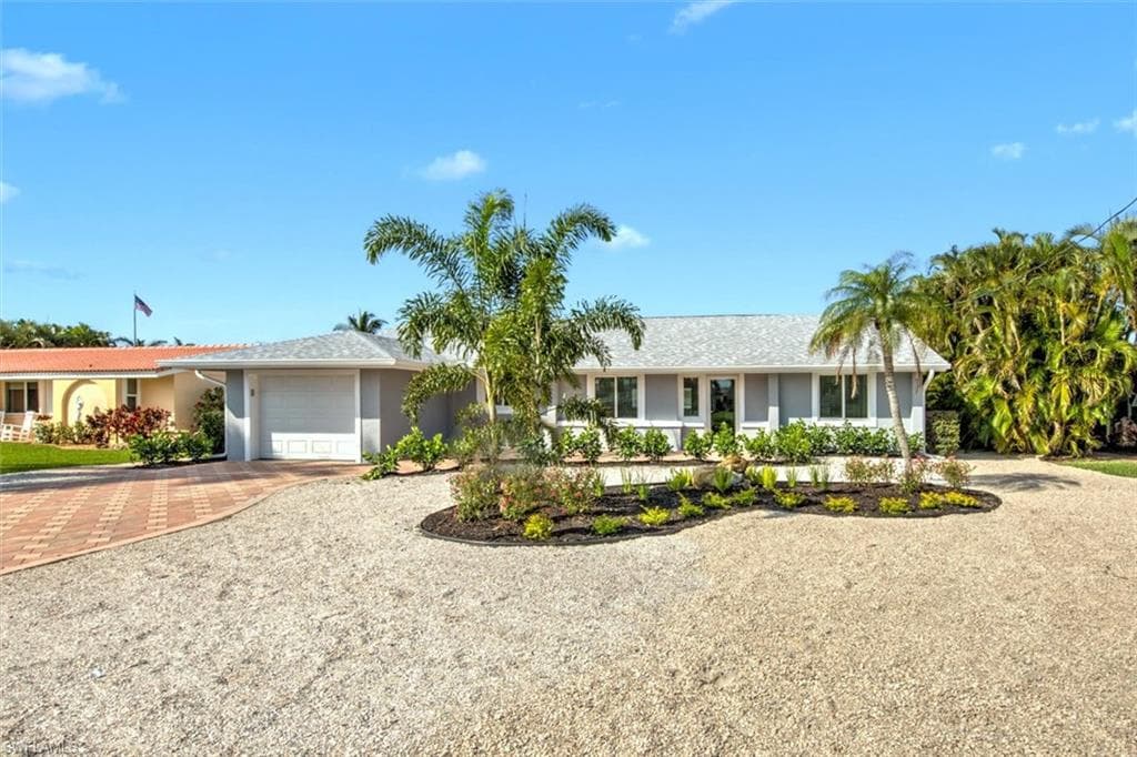 Single story home with a garage