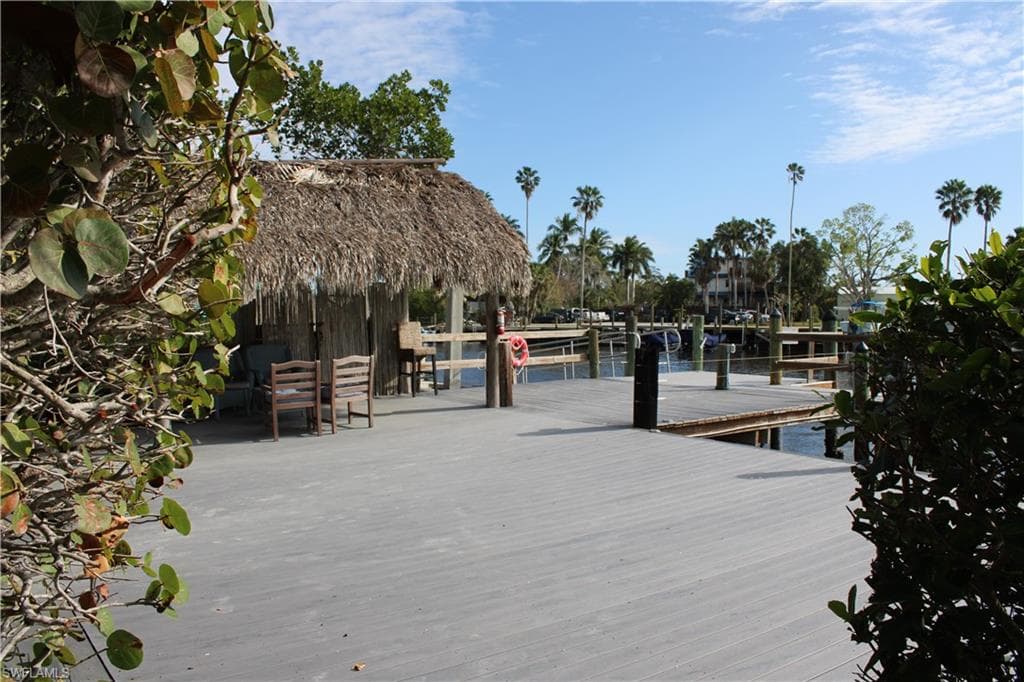 Dock area with a Chiki HUT with a water view