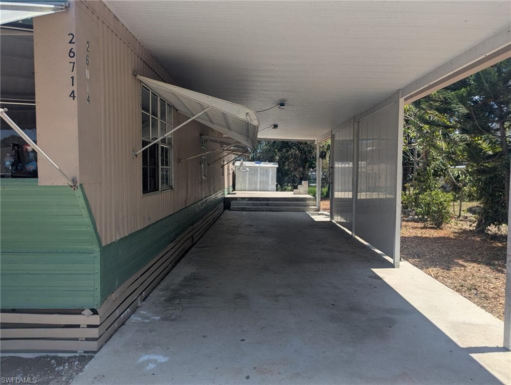 View of patio featuring a carport