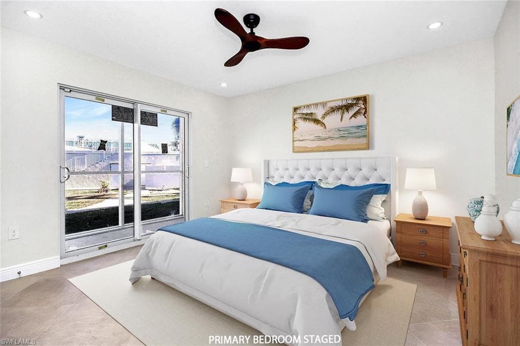Tiled bedroom featuring ceiling fan and access to exterior