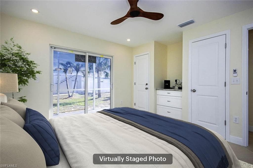 Bedroom featuring access to exterior and ceiling fan