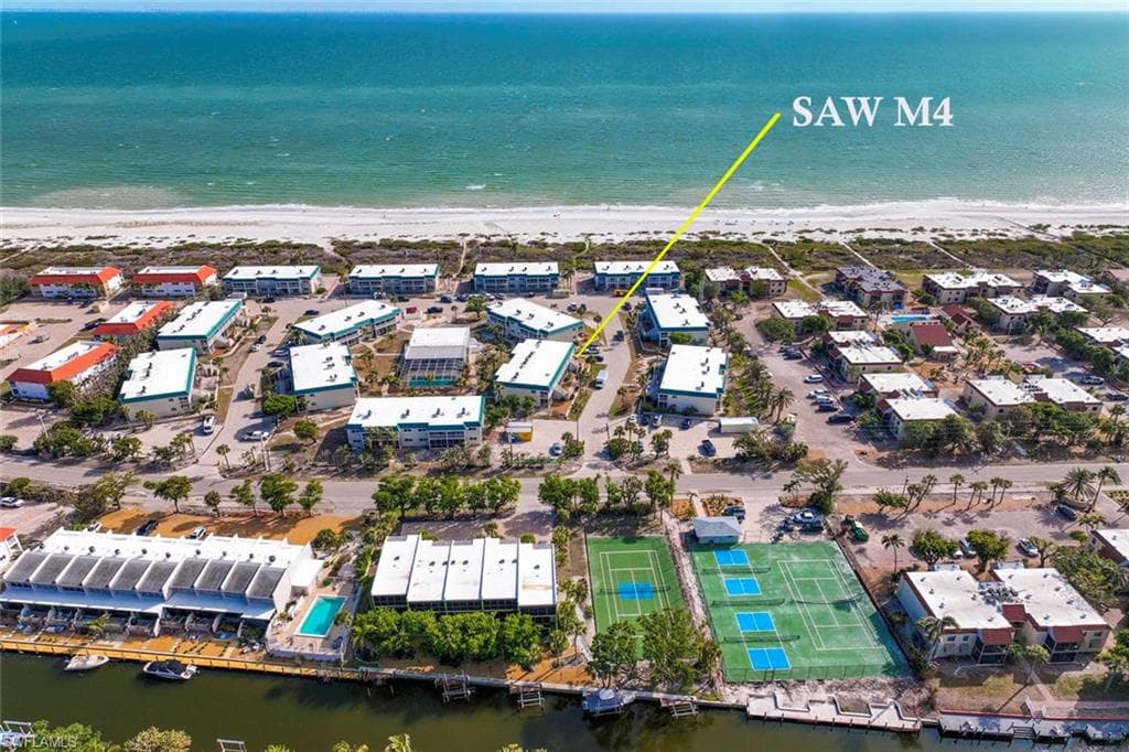 Drone / aerial view with a beach view and a water view
