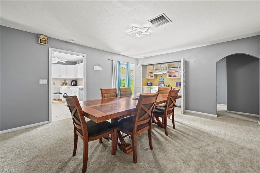 View of carpeted dining room