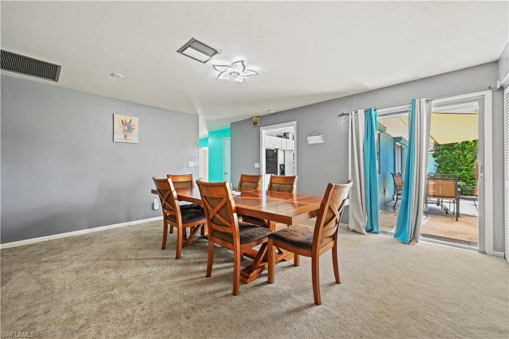 View of carpeted dining space