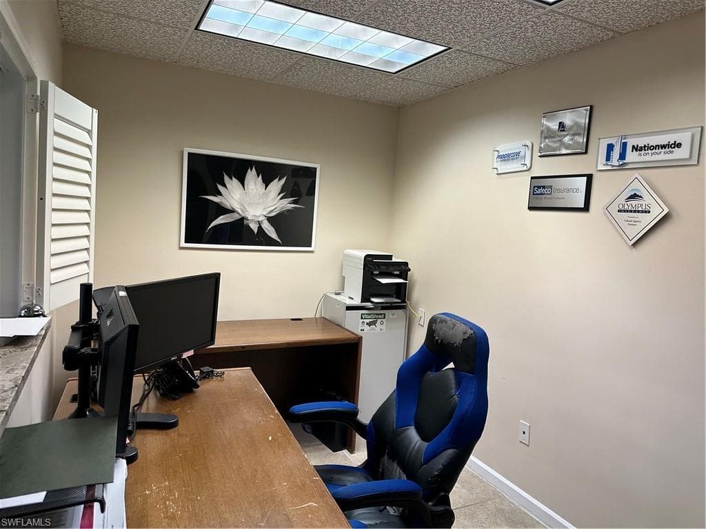 Office featuring a paneled ceiling