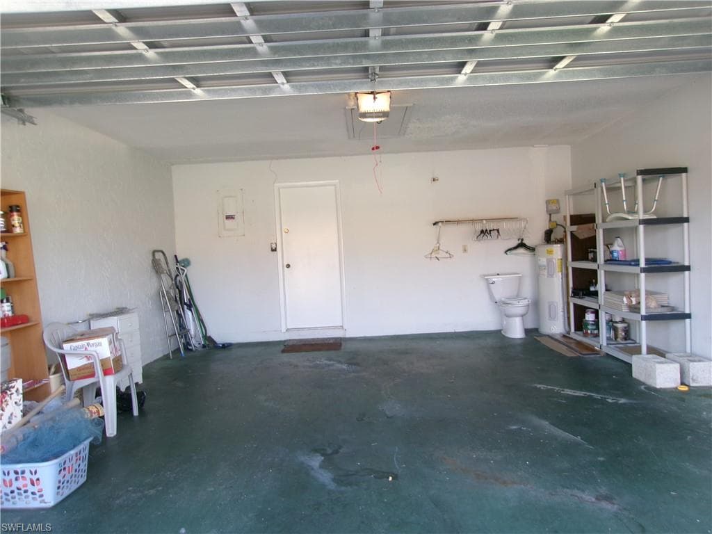 Garage with water heater and a garage door opener