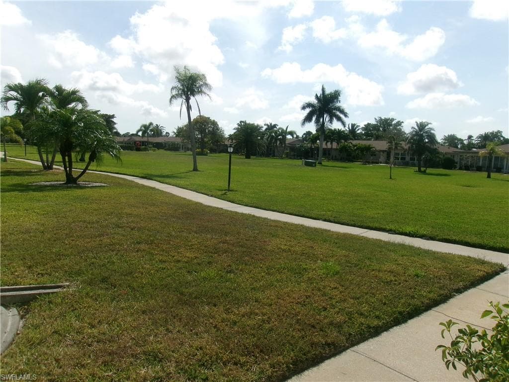 View of home's community featuring a lawn