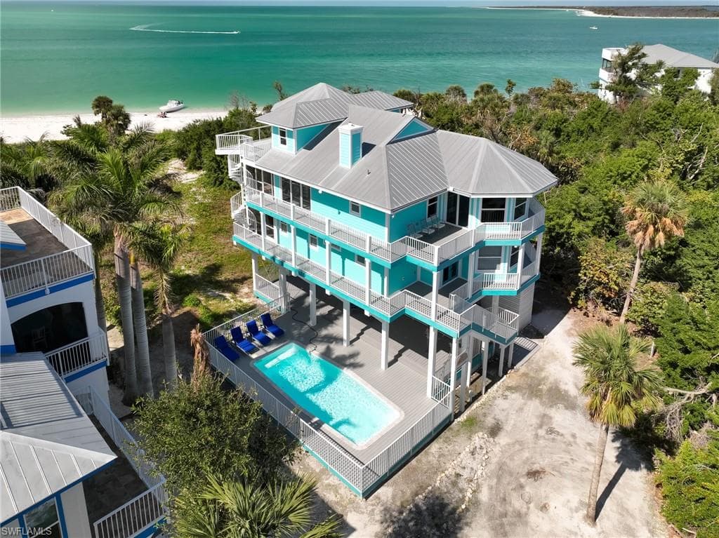 Aerial view featuring a water view